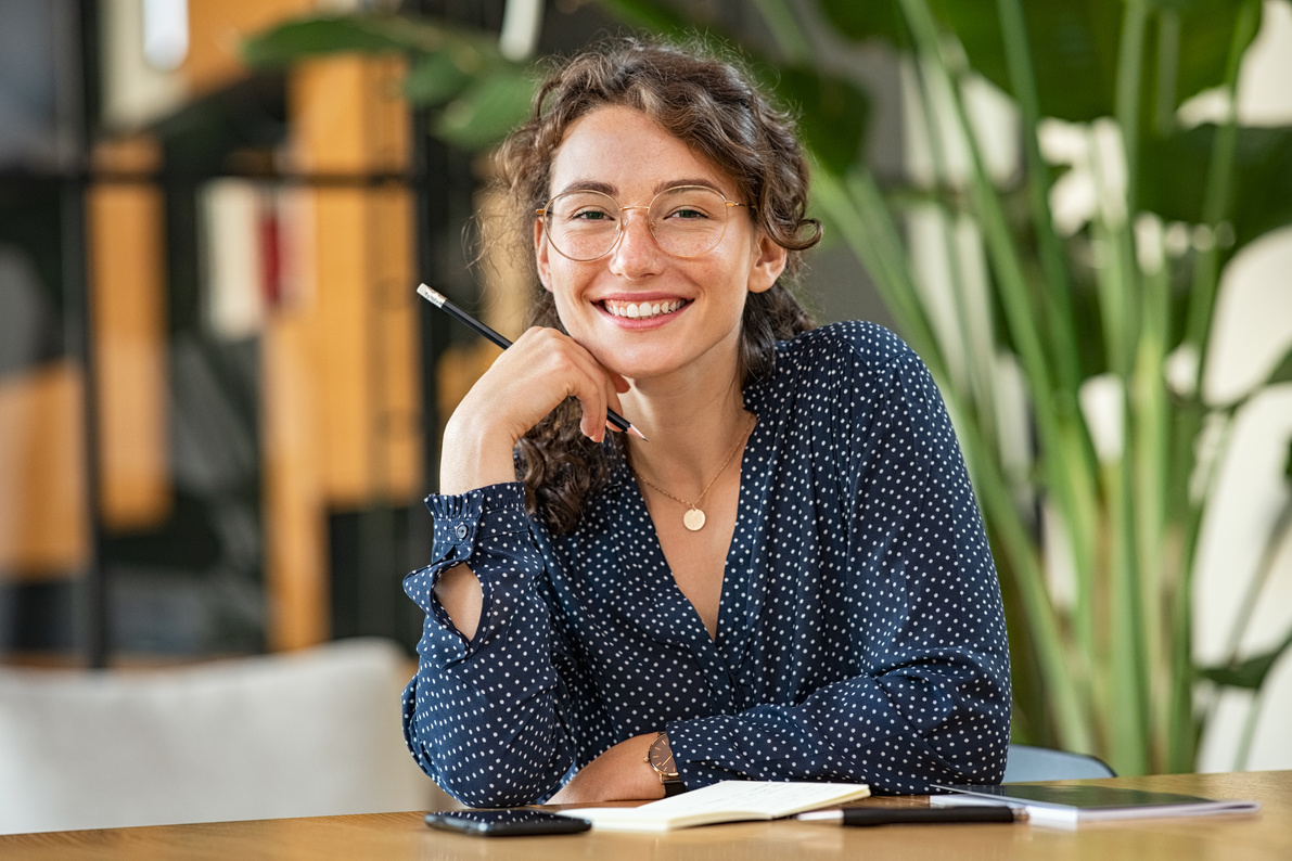 Portrait of Happy Smiling Woman at Desk